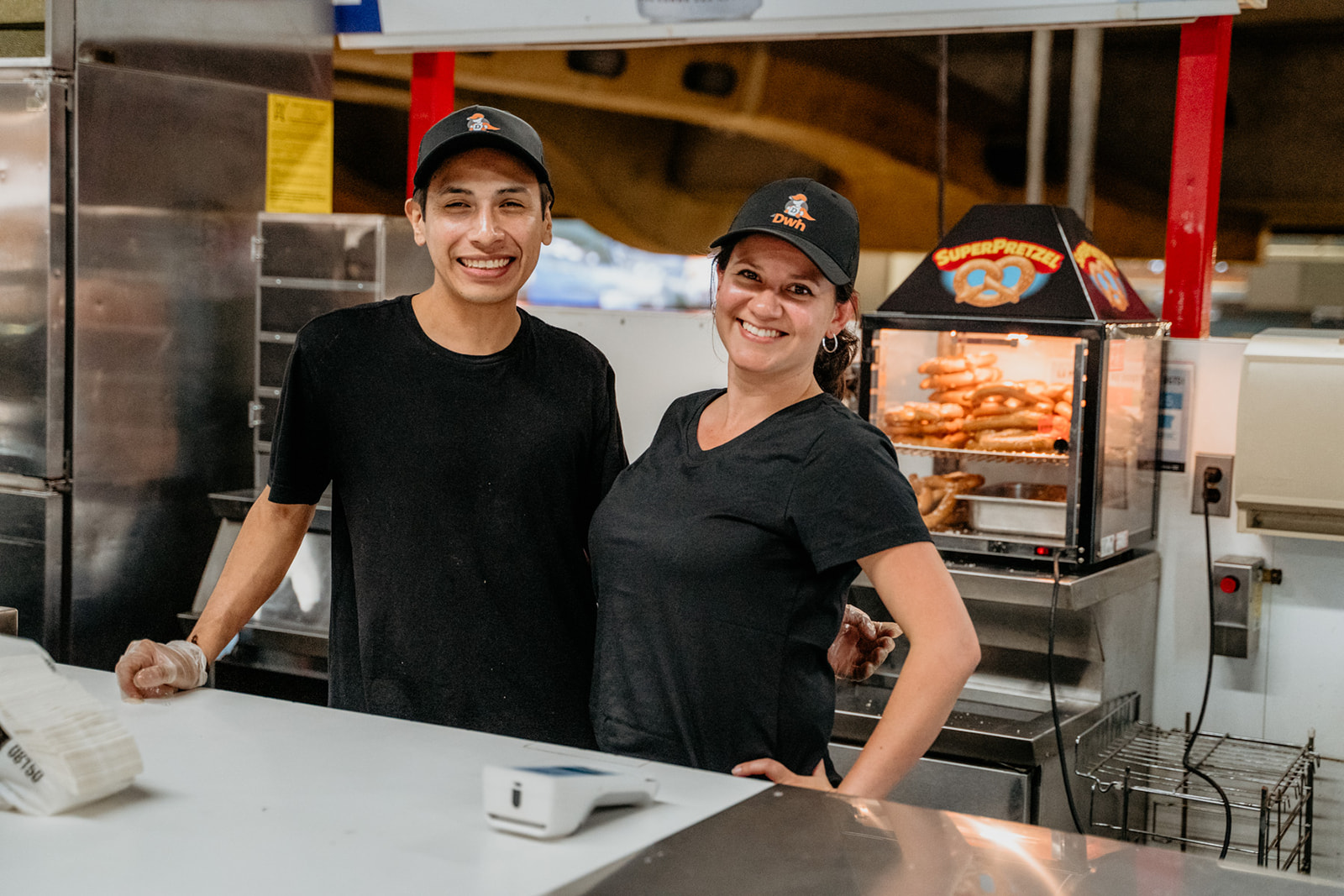 Hospitality industry professionals serving customers at a high-volume event venue